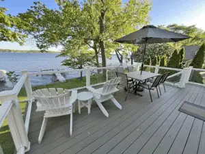 Large deck overlooking Pewaukee lake. Sliding doors open to the main floor living room, and kitchen for snack and bevvy reloading.