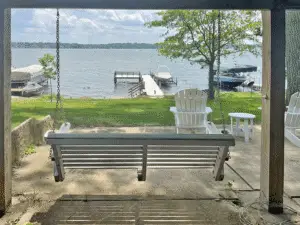 Porch swing under the deck. A bottle opener is in arm's reach––relax and take in Pewaukee Lake!