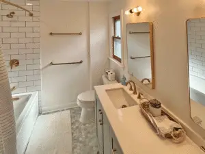 Newly remodeled master bathroom with dual sink vanities.