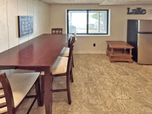 View #2 of lower level rec room with walkout door to lake. Stocked board games.