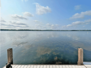 View from the pier bench overlooking Pewaukee Lake in the summer